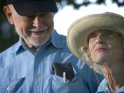 Virg Birdsall, left, admires his wife, Jean, right, before heading off on their daily stroll through Vancouver's H.B. Fuller Park Sept. 9.