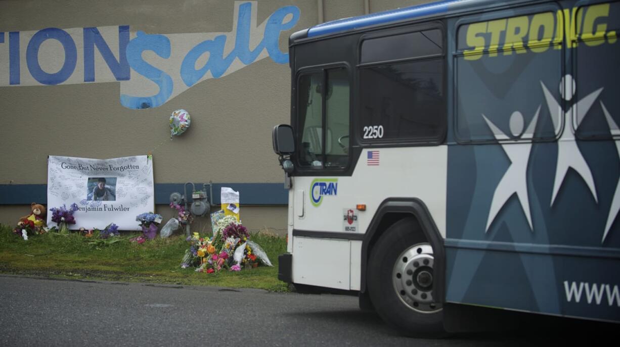 A C-Tran bus on Monday passes the site where 11-year-old Benjamin Fulwiler collided with a C-Tran on Saturday.