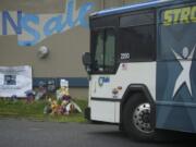 A C-Tran bus on Monday passes the site where 11-year-old Benjamin Fulwiler collided with a C-Tran on Saturday.