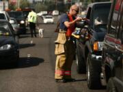 Firefighter/paramedic Erik Rosendahl collects a donation at the 'Fill the Boot' fundraiser near the corner of Fourth Plain and Andresen in September 2006. In 2011, the city of Vancouver told the firefighters union that it would not be allowed to use city streets for its annual fundraiser and held it in the unincorporated county.