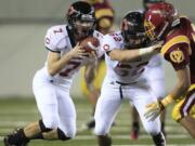 Camas' Nate Beasley catches a pass with Lyndon Schwilke gaurding for him against O'Dea during the first half of Friday's Class 3A state semifinal at the Tacoma Dome on Friday.