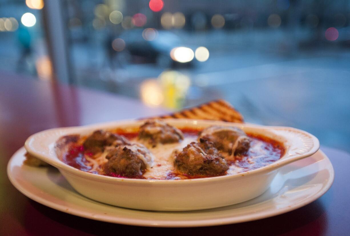 Meatballs in tomato sauce are served Jan. 14 at the Top Shelf Cocktail and Martini Bar in downtown Vancouver. The restaurant is expected to roll out an expanded menu this weekend.