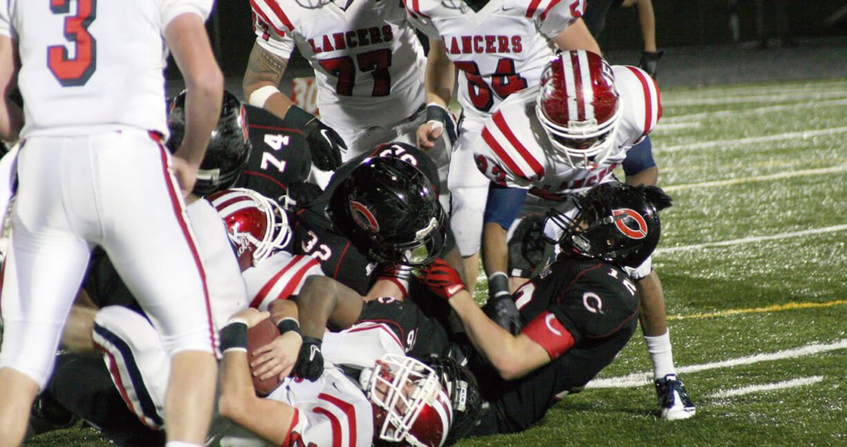 Kennedy runs into the Camas bulldozers Friday night, at Doc Harris Stadium.