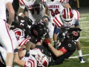 Kennedy runs into the Camas bulldozers Friday night, at Doc Harris Stadium.