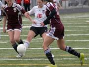 Rachel Gibson (16) takes a shot at the net for the Camas High School girls soccer team. The Papermakers played their hearts out in the first round of state Nov.