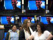 Shoppers browse the Fred Meyer electronics department during Black Friday sales.