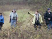 Birders look for feathered friends at the Ridgefield National Wildlife Refuge.