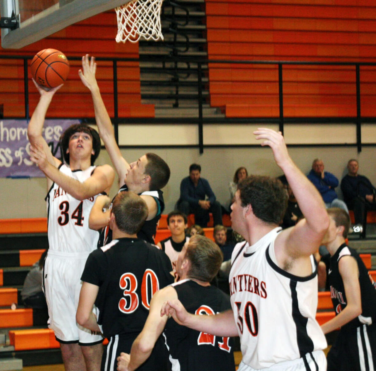 Aaron Diester (34) and Isaac Bischoff (50) give Washougal speed, strength and agility under the basket. The Panthers host La Center in the first game tonight.