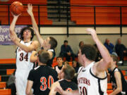 Aaron Diester (34) and Isaac Bischoff (50) give Washougal speed, strength and agility under the basket. The Panthers host La Center in the first game tonight.