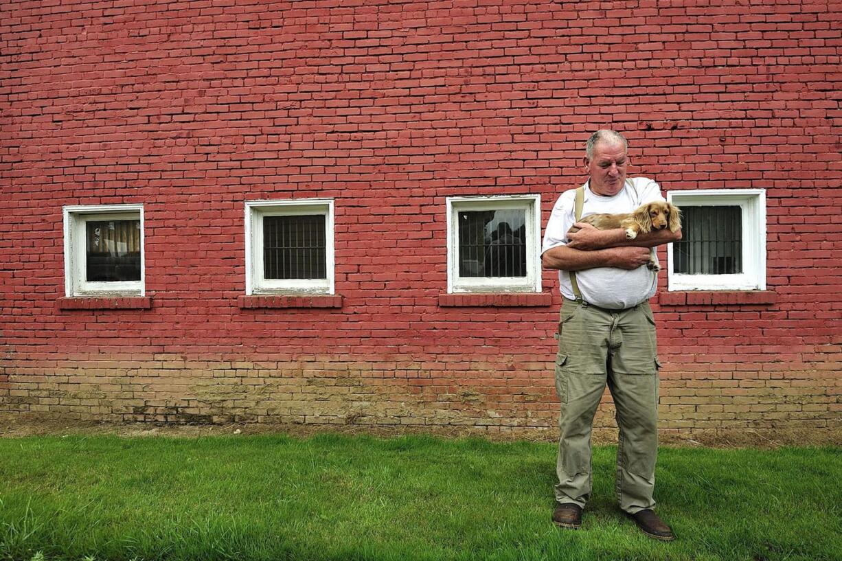 Mike Tester, a retired construction worker and logger, stands outside the former city hall  in Yacolt. The city is hoping to convert the building into a museum.