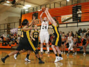 Maddie Down shoots and scores over three Hudson's Bay defenders Monday, at Washougal High School.