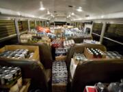 A bus from Camas High School filled with food is weighed during the Stuff the Bus food drive ceremony at Exterior Wood in Washougal, Friday, December 10, 2010.