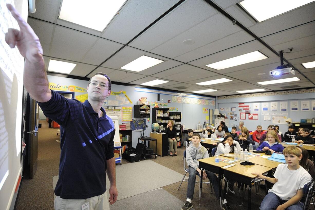 Photos by Troy Wayrynen/The Columbian Vancouver historian and author Caleb Johnson explains to Sunset Elementary School students how research has shaped what he has written about the pilgrims and their experiences in Plymouth Colony four centuries ago.