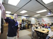 Photos by Troy Wayrynen/The Columbian Vancouver historian and author Caleb Johnson explains to Sunset Elementary School students how research has shaped what he has written about the pilgrims and their experiences in Plymouth Colony four centuries ago.