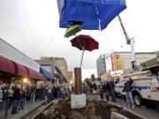 More than 200 people attended the unveiling of &quot;Flying Umbrellas&quot; on Friday evening in downtown Vancouver.