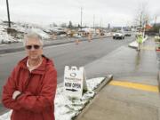 Washougal Quiznos owner Mitch Hammontree said restaurant sales are down by more than 50 percent because the sandwich shop is obscured from view by a mound of dirt brought in to rebuild interchanges on state Highway 14.