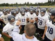 Assistant football coach Jim Gray talks to the Skyview High School football team during a break at practice Thursday August 18, 2011 in Vancouver, Washington.