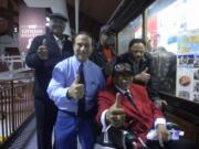 Hudsonis Bay: Ben &quot;Flaps&quot; Berry, Tuskegee Airman and Congressional Gold Medal recipient (red jacket) gives a thumbs up to Pearson Air Museum's new Tuskegee Airmen display case.