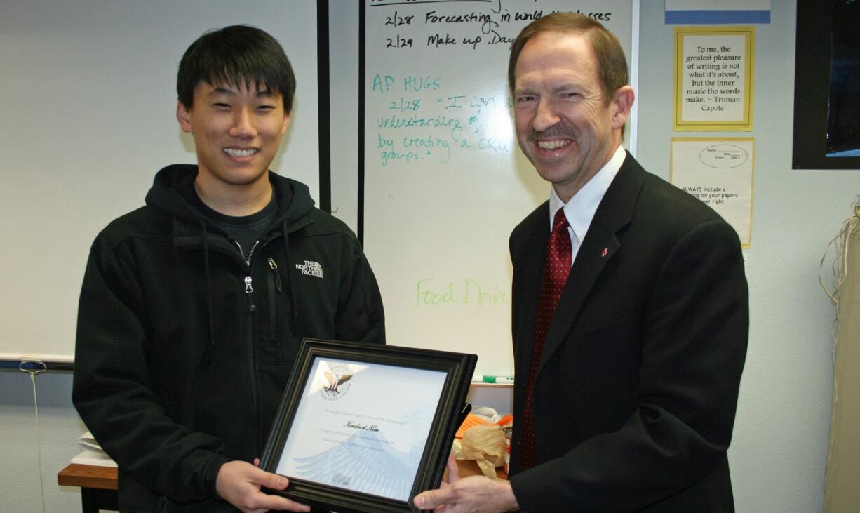 Mountain View: Kenny Kim, left, receives the President's Volunteer Service Award from Randy Salisbury, Southwest Washington American Red Cross board chairman.