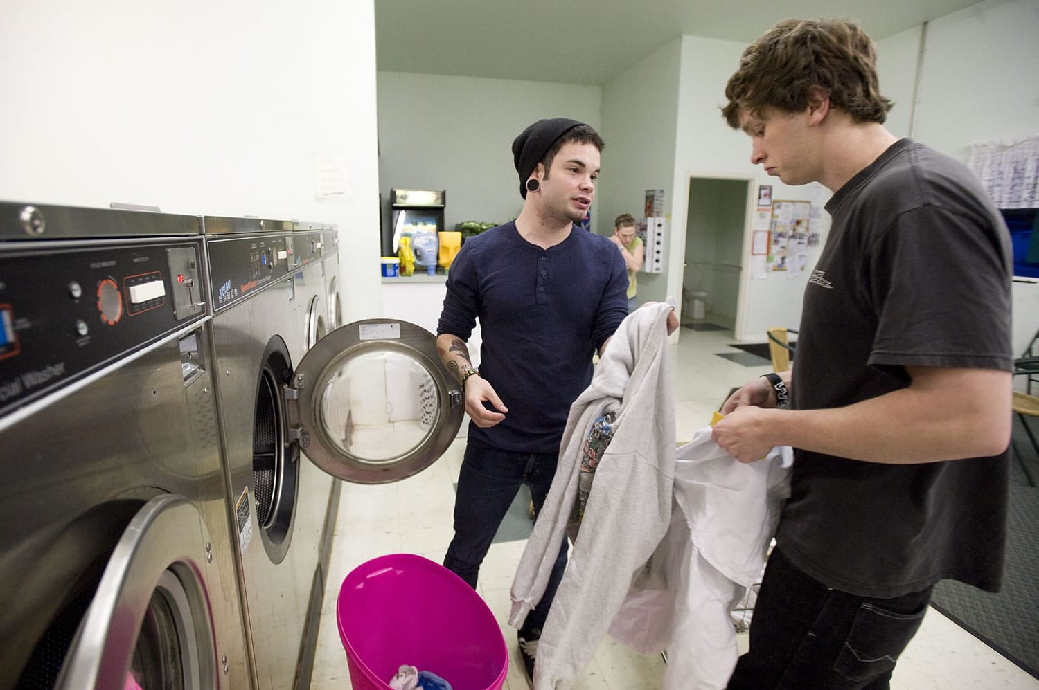 Robert Seals, 22, left, and his brother Isaiah Seals, 20, are barely scraping by   so they're grateful for Laundy Love, a charitable program put on by Camas Friends Church.