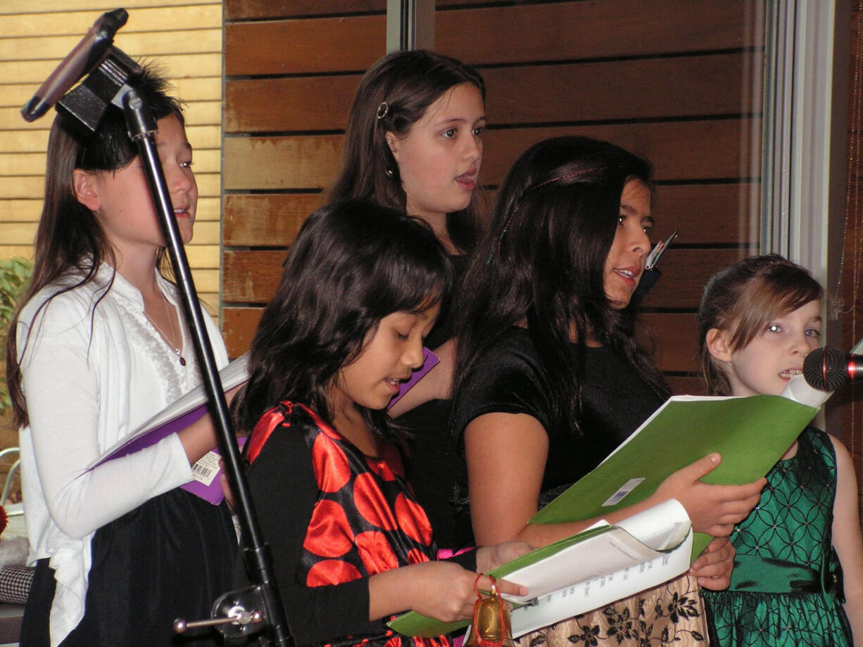 Fircrest: The Firstenburg Girls Choir performed at the Loaves and Fishes Christmas Brunch on Dec. 23. Back row from left are Elin Bertheau and Caprial Nead.