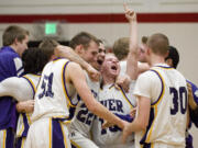 Columbia River celebrates after beating Mt. View to win the GSHL 3A District Basketball Tournament at Fort Vancouver High School, Friday, February 10, 2012.