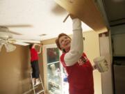 Cathie Pollock, right, from Keller Williams Realty, and Suzanne Luttrell, from Paramount Equity, work inside the home of James &quot;Mike&quot; Curry Thursday morning in Vancouver.