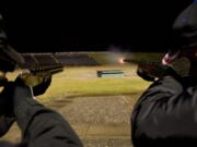 Mike Green, left, and Mike Williams shoot at the Vancouver Trap and Gun Club on Wednesday.