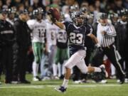 Forrest Russell, 23, of Skyview High School runs back an interception for a touchdown during the second half in a playoff game against Kentwood High School Friday November 11, 2011 in Vancouver, Washington. Skyview beat Kentwood 34-7.