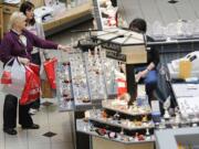 Christine Wright, left, of Portland, and Lorin McCoy, right, of Gresham, Ore., shop at Westfield Vancouver mall.