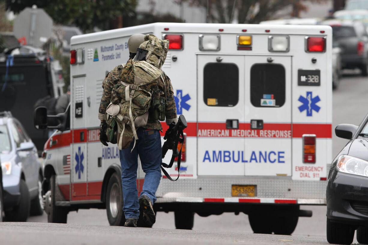 The Portland Police Bureau Special Emergency Reaction Team responds to a March shooting in Portland that injured two officers, one critically.