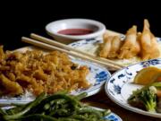 The Crispy Shrimp Rolls (clockwise from top), Dragon and Phoenix, Sauteed String Beans and Sesame Chicken were memorable dishes at the Golden City.