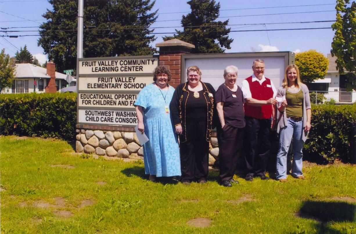 Fruit Valley: Debbie Elliott, Fruit Valley Elementary principal, from left; Karin Custance and Sandra Extine, members of Sons of Norway; Ken Johansen, lodge president, presents check to Staci Boehike, school family resource center liaison.