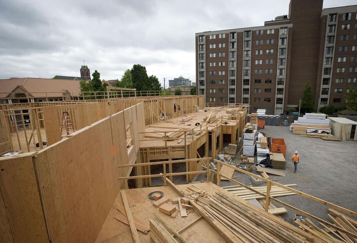 Construction crews work on Vista Court, a 76-unit residential project for seniors being developed by the Vancouver Housing Authority.