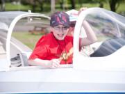 Kaya Galbraith, 13, was among the lucky students who received a free airplane ride during Pearson Air Museum's Open Cockpit Day.