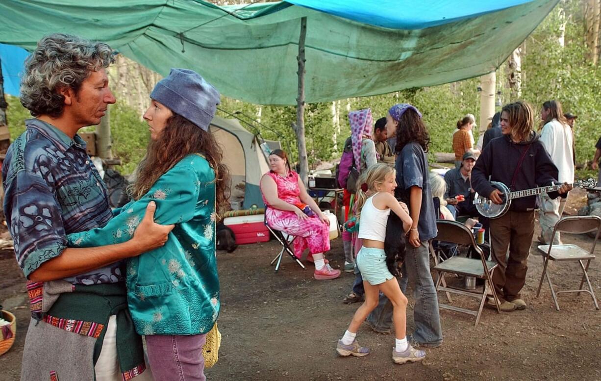 A meditating couple embrace at the 2004 Rainbow Gathering in the Modoc National Forest, Calif.