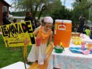 Fairgrounds: Isabel Peters, 8, sells lemonade during The Gardner School fundraiser for the American Cancer Society.