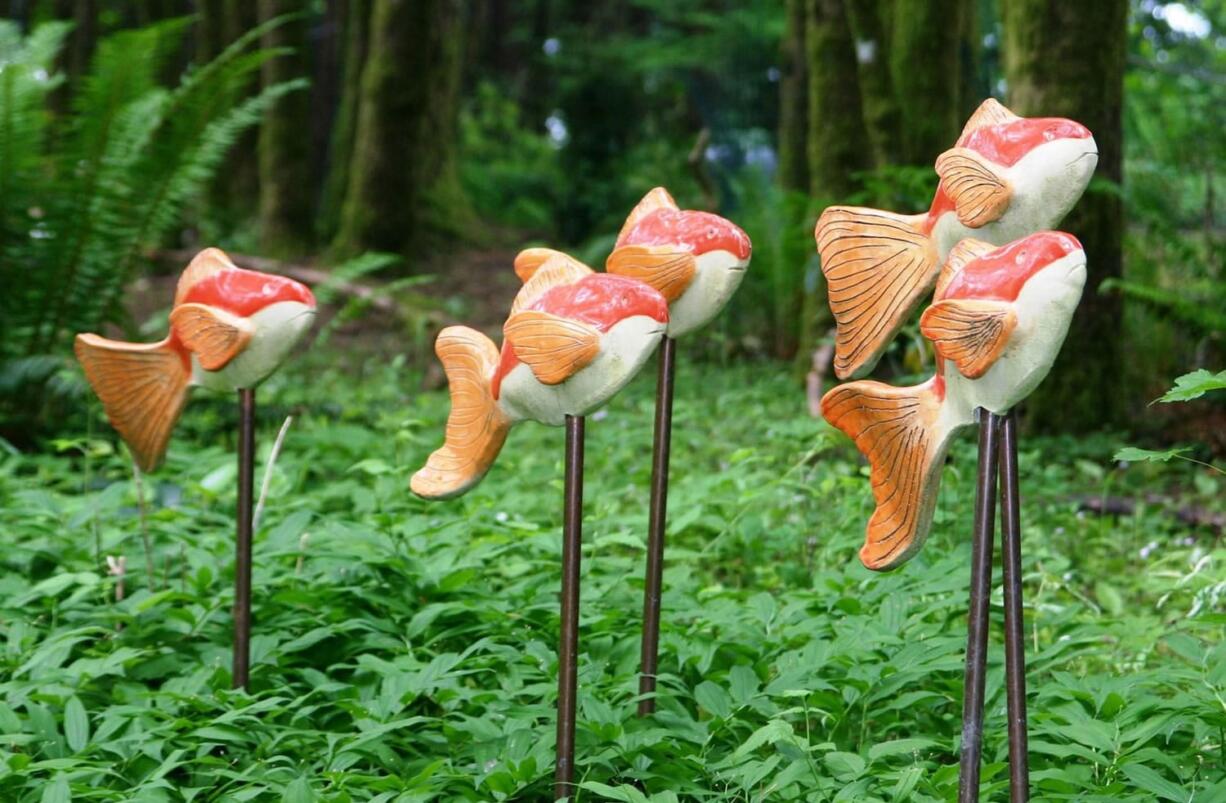 Ceramic artist Polly McCarter created a school of hand-made ceramic fish floating above a sea of Solomon Seal to highlight a recent open garden tour.