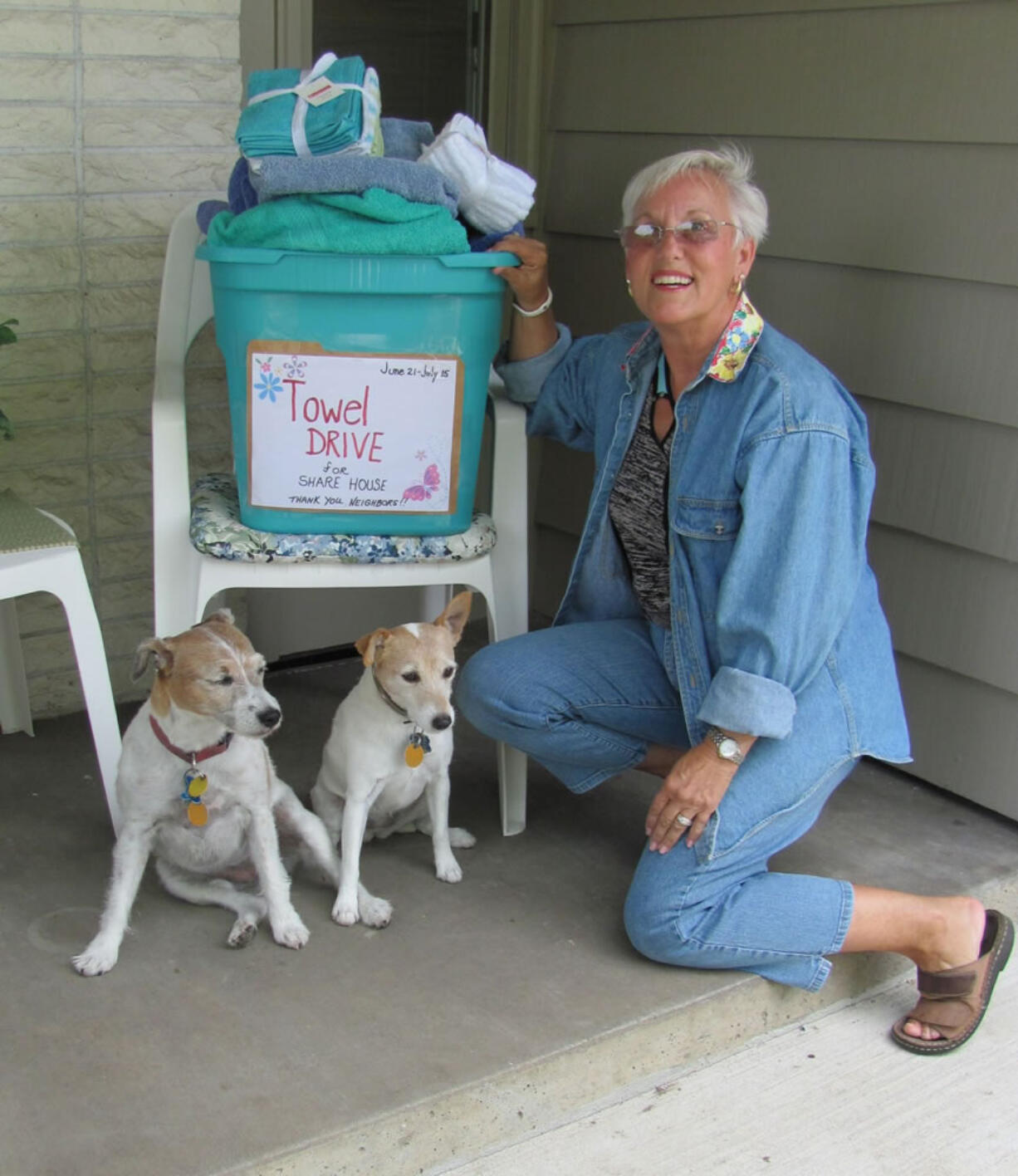 Jeanne Church drops a donation during the Wildwood neighborhood towel drive for Share.