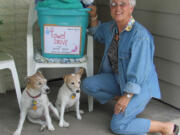 Jeanne Church drops a donation during the Wildwood neighborhood towel drive for Share.