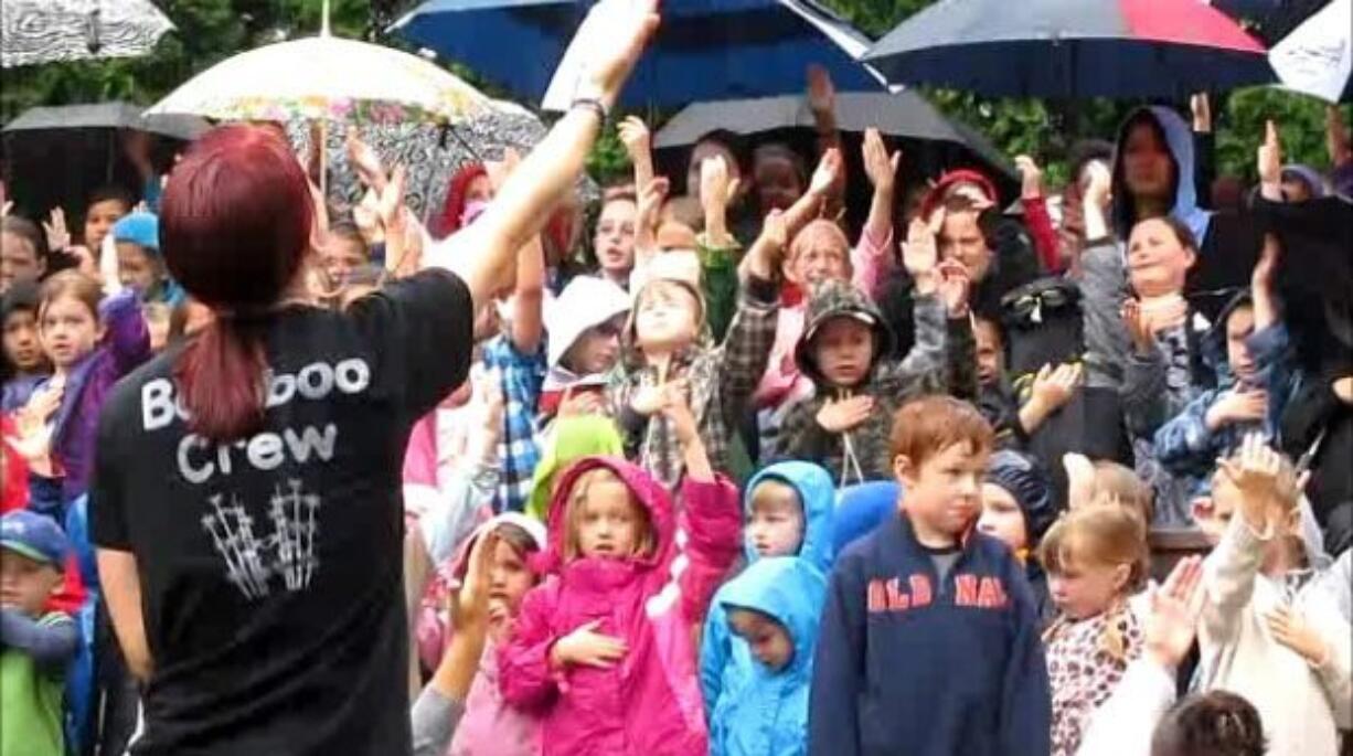 Cindy Wood leads children in their final vacation Bible school program at the Real Life Community Church, despite a rainstorm.