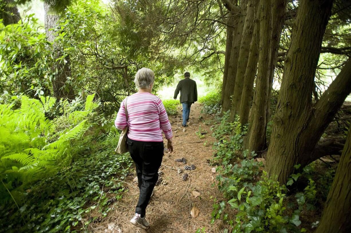 Florence Wager and Kelly Punteney explore the Weber Arboretum property on Southeast Evergreen Highway.