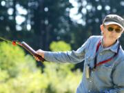 Terrance Olson, 62, a facilities worker for Washington State University Vancouver, points out some of the places where he has been removing blackberry bushes in the Mill Creek area, east of campus, this month.