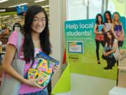 Rachel Lee collects school supplies during the DoSomething.org scavenger hunt.