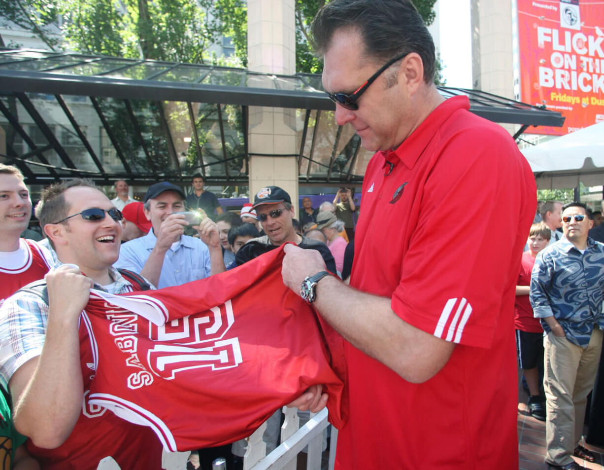 Newly-enshrined Hall of Famer Arvydas Sabonis arrives at a downtown rally in his honor Thursday, Aug. 18, 2011 in Portland, Ore.