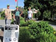 Volunteers, from left, Paul Brauer Jr., Paul Brauer III and Brad Barnes help give the gardens around the historic Slocum House a face-lift.