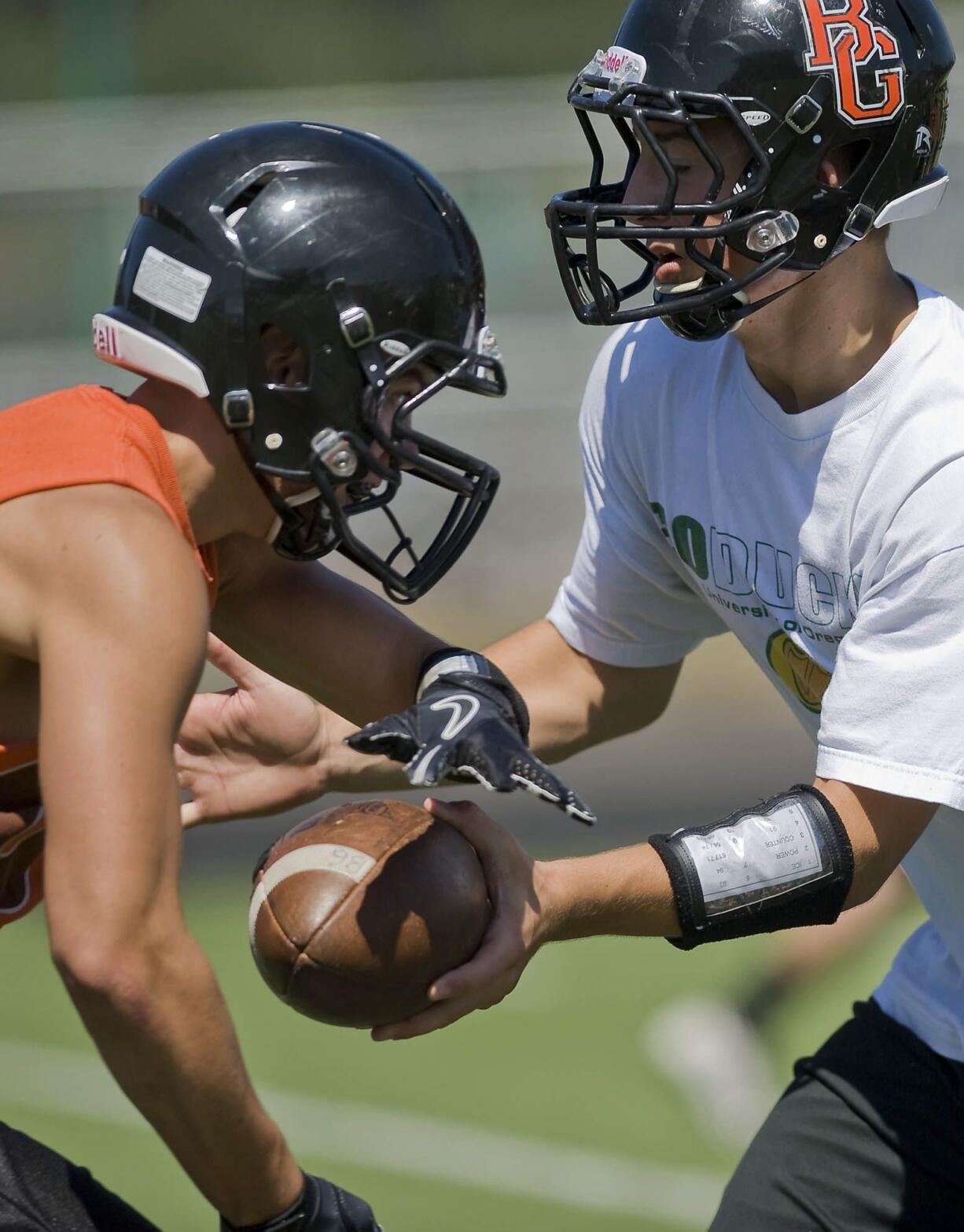 Quarterback Ian Humphrey, right, and teammate Tyler Bergeron hope to help Battle Ground reverse its fortunes in football following a 1-8 season that coach Larry Peck said &quot;just about killed&quot; him.