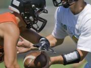 Quarterback Ian Humphrey, right, and teammate Tyler Bergeron hope to help Battle Ground reverse its fortunes in football following a 1-8 season that coach Larry Peck said &quot;just about killed&quot; him.