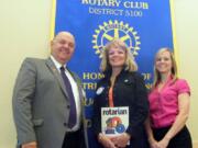 Battle Ground High School Assistant Principal Jann Byrd, center, received the Transformer Award from the Lewis River Rotary.