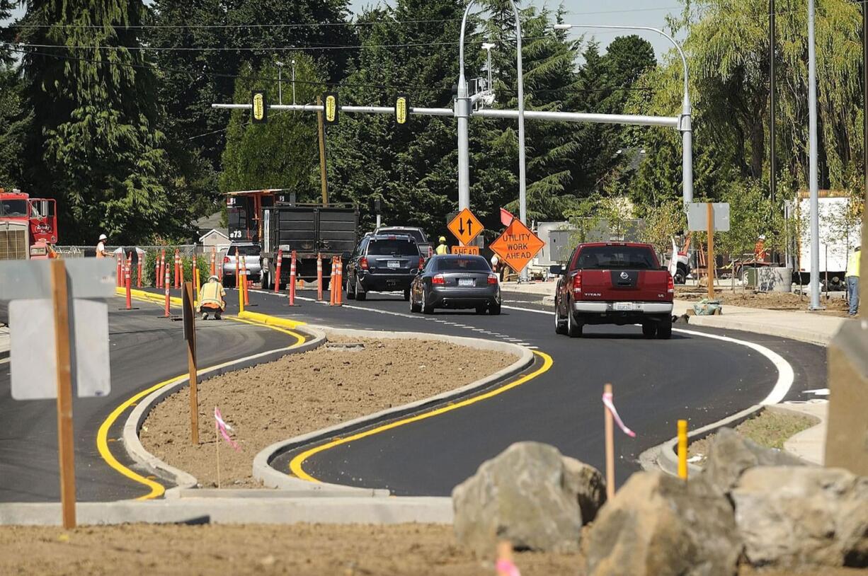 Traffic passes by the main entry of the new C-Tran park and ride, which is still under construction, in Salmon Creek.